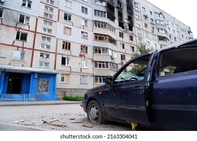 Shot, burned cars of civilians. War of Russia against Ukraine. Cars damaged after shelling. Kharkov, Ukraine. War crimes.