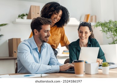 Shot of business people working with laptop and talking of they new project together in the office.