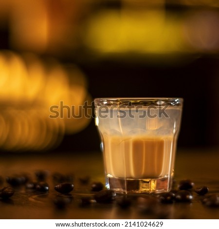 shot of coffee drink, coffee beans on wooden table square