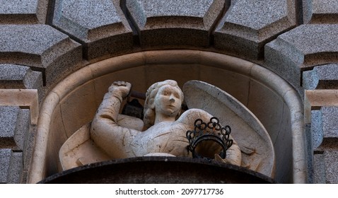 Shot In Color Detail On The Facade Of This Historic Building Representing Some Character, Animal Or Flower. Set At Montjuïc Cemetery, Barcelona, Catalunya, Spain, Europe