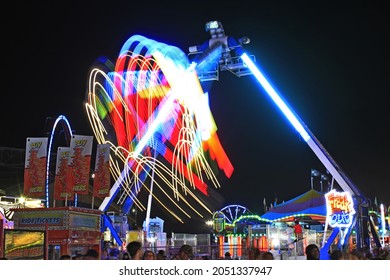 A Shot Of A Colorful Fair Ride At Night  At The Kansas State Fair In Hutchinson Kansas USA That Was On 9-18-2021 .