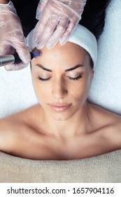 Shot of cosmetologist making mesotherapy injection with dermapen on face for rejuvenation on the spa center. - Shutterstock ID 1657904116
