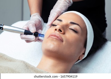 Shot of cosmetologist making mesotherapy injection with dermapen on face for rejuvenation on the spa center. - Shutterstock ID 1657904119