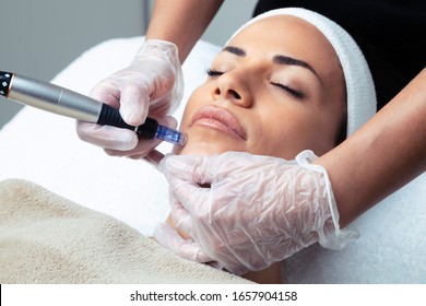 Shot of cosmetologist making mesotherapy injection with dermapen on face for rejuvenation on the spa center. - Shutterstock ID 1657904158