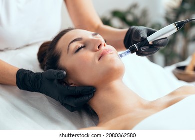 Shot of cosmetologist making mesotherapy injection with dermapen on face for rejuvenation on the spa center. - Shutterstock ID 2080362580