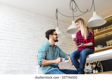 Shot of a couple enjoying a coffee break together. Selective focus on him, shallow depth of field.
 - Powered by Shutterstock