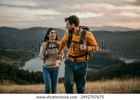 Similar – Image, Stock Photo Hiking in mountains. Mountain landscape. Scenic view of mountain peaks. Panoramic view. Natural scenery. Beautiful background