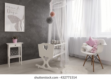 Shot Of A Cozy Baby Girl Room With A Big Window