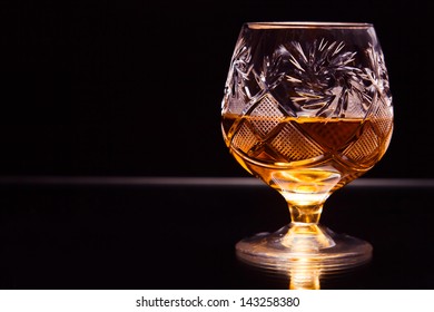 Shot Of A Cut Crystal Glass Containing Brandy.