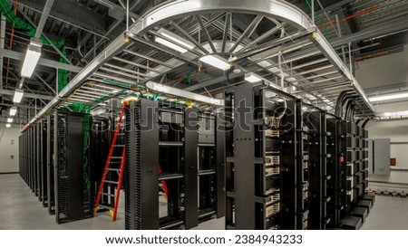 Shot of Data Center With Multiple Rows of Fully Operational Server Racks. Modern Telecommunications, Artificial Intelligence, Supercomputer Technology Concept. Shot in Dark