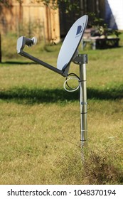 A Shot Of A Directv Dish In A Yard With Grass. In Hutchinson Kansas USA On 10-26-2014.