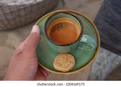 A Shot Of Double Espresso In Hand.