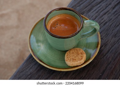 A Shot Of Double Espresso On A Green Cup.