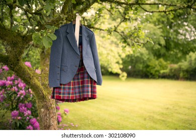 Shot Of A Dress Kilt Hanging On Wooden Frame