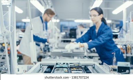 Shot of an Electronics Factory Workers Assembling Circuit Boards by Hand While it Stands on the Assembly Line. High Tech Factory Facility. - Shutterstock ID 1381707224