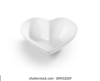 Shot of an empty heart shaped cereal bowl cut out and isolated on white.