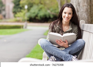 A shot of an ethnic college student studying on campus
