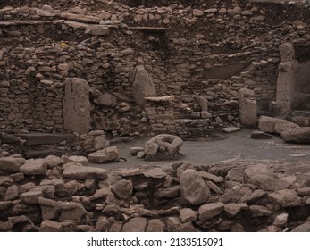 A Shot From The Excavation Site In KArahan Tepe Archeological Area. Several Megaliths, Broken Pieces Of The Pillars And A Part Of A Circle Shape,  Gathering Area, Stones Can Be Seen On The Image. 