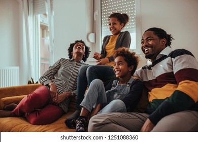 Shot of a family watching television together at home - Powered by Shutterstock