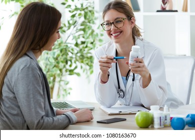 Shot Of Female Dietician Prescribing Nutritional Supplement For Patient In The Consultation.