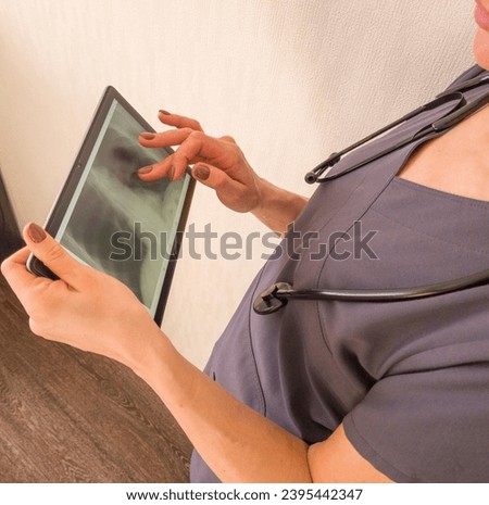 Similar – Female doctor showing an x-ray on the tablet