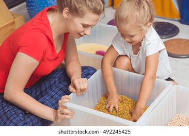 Shot Of A Female Physiotherapist With Her Little Patient During A Sensory Integration Therapy