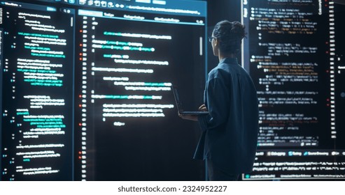 Shot of Female Programmer Working in a Monitoring Control Room, Surrounded by Big Screens Displaying Lines of Programming Language Code. Portrait of Woman Creating a Software, Coding - Powered by Shutterstock - Get 15% off with code: PIKWIZARD15