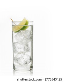 Shot of a glass of gin and tonic with ice and lime  on white background with copy space