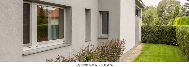 Shot Of A Grey Wall Of A Detached House