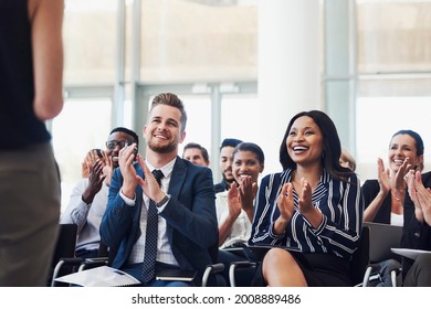Shot of a group of businesspeople clapping during a conference - Shutterstock ID 2008889486