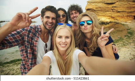 Shot Of A Group Of Friends Taking A Selfie On The Beach