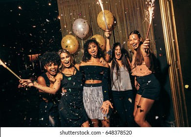 Shot Of Group Of Girls In The Nightclub Having A Great Time. Group Of Female Friends Partying In Pub.