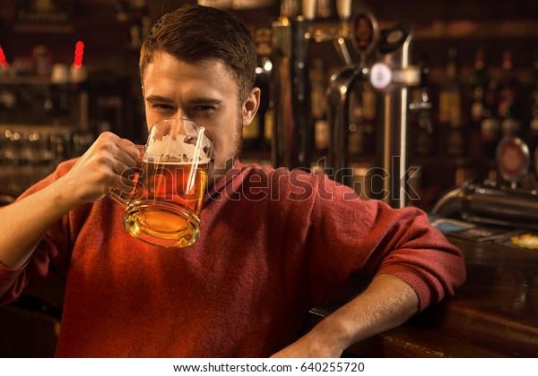 Download Shot Handsome Young Man Drinking Beer Stock Photo Edit Now 640255720 PSD Mockup Templates