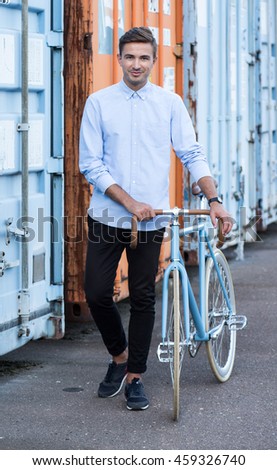 Similar – Image, Stock Photo Young man with bicycle in the sea