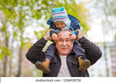 Shot of a happy senior man smiling looking away his grandson hugging him from behind copyspace relax family love people children retirement vitality lifestyle parenting childhood values weekend
