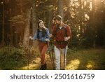 Shot of a happy young couple going for a romantic walk in the woods