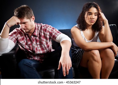 A Shot Of An Interracial Couple Having A Relationship Problem