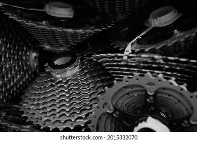 A shot into a box full of cogs and sprockets in a bicycle production.