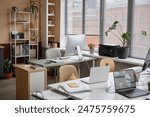 Shot of light cozy office interior in modern minimalistic style with working desks and plants, copy space