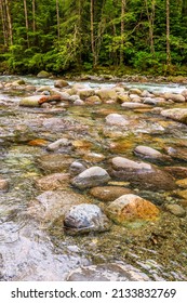 shot of majestic mountain creek with rocky background in Vancouver, Canada - Shutterstock ID 2133832769