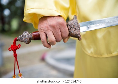 Shot Of Man Holding Chinese Sword.