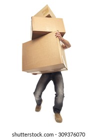 Shot Of Man Struggling To Carry Boxes While Moving House 