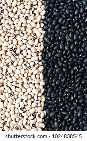 A shot of medium-sized black beans and black-eyed peas out of shell (black-eyed beans or goat peas). Background