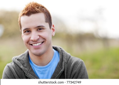 A Shot Of A Mixed Race Man Smiling Outside