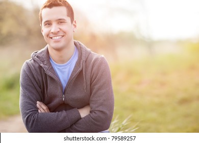 A Shot Of A Mixed Race Man Smiling Outside