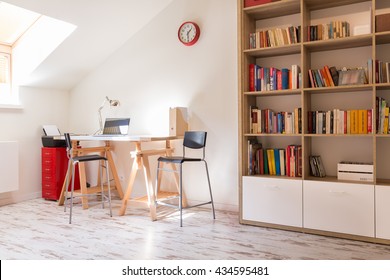 Shot Of A Modern Study With A Desk And A Bookshelf