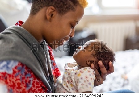 Shot of a mother spending time with her newborn baby
