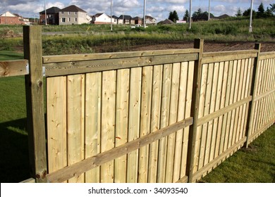 A Shot Of A New Fence Under Construction, In A New Subdivision.