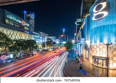 Shot on 20 September 2017: Bangkok Traffic in Rush Hour at Central World and Gaysorn Plaza Intersection, Ratchaprasong Intersection is one of busiest CBD in Bangkok, Light Trails of Cars.