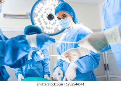 Shot in the Operating Room, Assistant Hands out Instruments to Surgeons During Operation. Surgeons Perform Operation. Professional Medical Doctors Performing Surgery. - Powered by Shutterstock